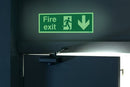 Safety Sign Niteglo Fire Exit Running Man Arrow Down Self-Adhesive 150x450mm NG28A/S